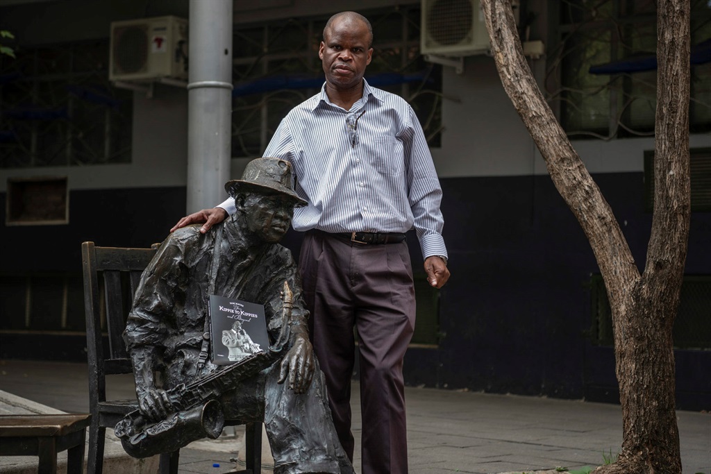 Author Sam Mathe standing outside the old Kippies jazz club in Newtown, Joburg. Photo by Ihsaan Haffejee/NewFrame