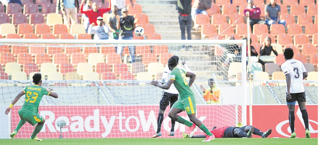 Baroka FC’s Victor Letsoalo celebrates his goal while Black Leopards’ goalkeeper Rotshidzwa Muleka is seemingly out cold on the ground in their relegation/ promotion play-offs match at Peter Mokaba Stadium yesterday. Photo by Samuel Shivambu/Backpagepix