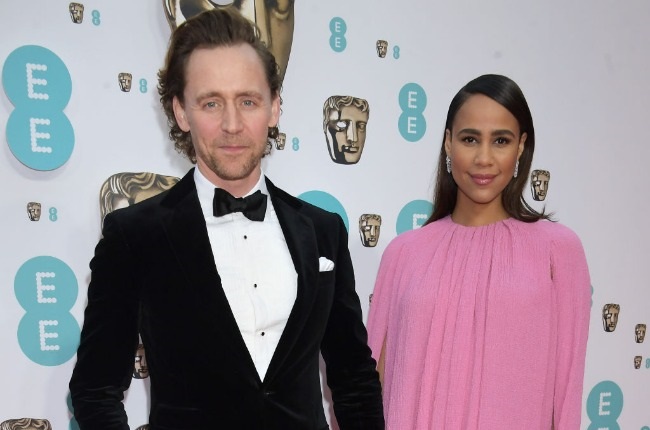 Tom Hiddleston and Zawe Ashton were beaming as they posed on the red carpet at the Baftas. (PHOTO: Getty Images)