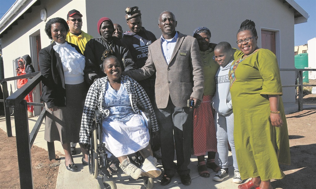 Nomalanga Ndamase, surrounded by family, friends and officials during the handover of her home. Photo by Yanga Soji