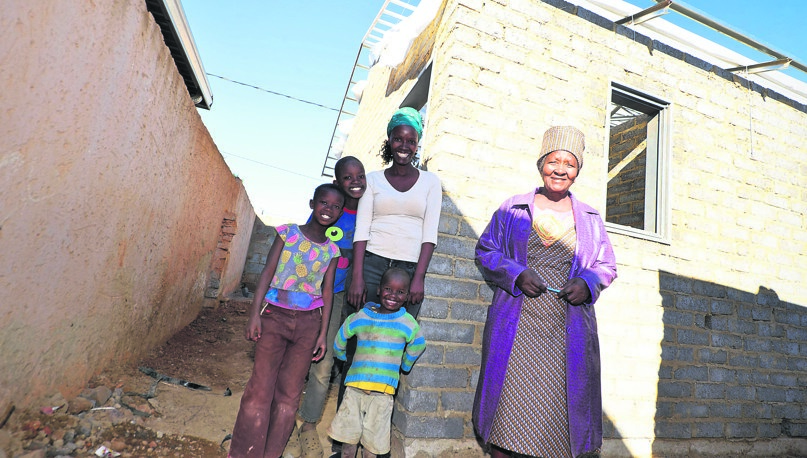 From left: Refiloe (8), Karabo (10), Meme (32), Lehlohonolo (3) and gogo Sesi Thobeha (70) are excited to see their dream of having a home finally come true.       Photo by Lucky Morajane