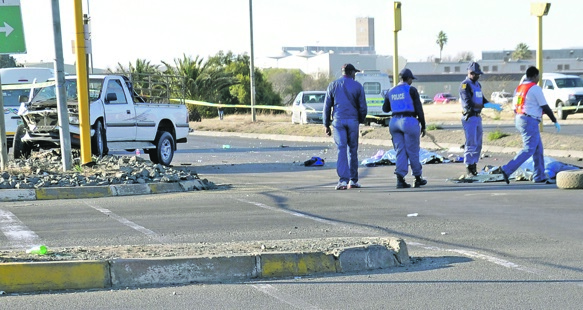 Police at the scene of the deadly accident on Oliver Tambo Street in the Bloemfontein CBD.          Photo by Kabelo Tlhabanelo