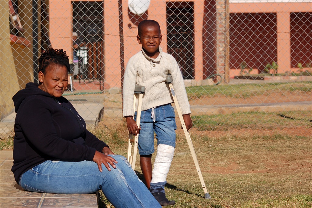 Phumeza Pongoma (47) with her son Oyintanda whose leg was allegedly broken by a JoJo water tank. Photo by Thamsanqa Mbovane
