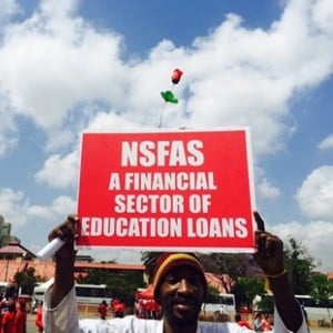 A protester holds up a placard indicating his opinion on NSFAS. (EWN, Twitter)