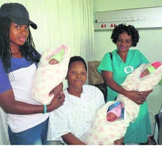 Holding the babies are mum Sithandiwe Madlokovu (middle) her cousin Amanda Mjoli (left) and nurse Xolisile Shabalala. 