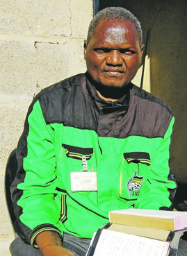 Disappointed Michael Kgabo holds his torn Bible.      Photo by     Karabo Rammutla