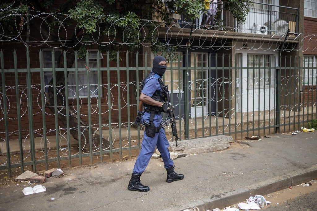 SAPS patrol to enforce lockdown regulations amid concern of the spread of Covid-19. (Michele Spatari / AFP)