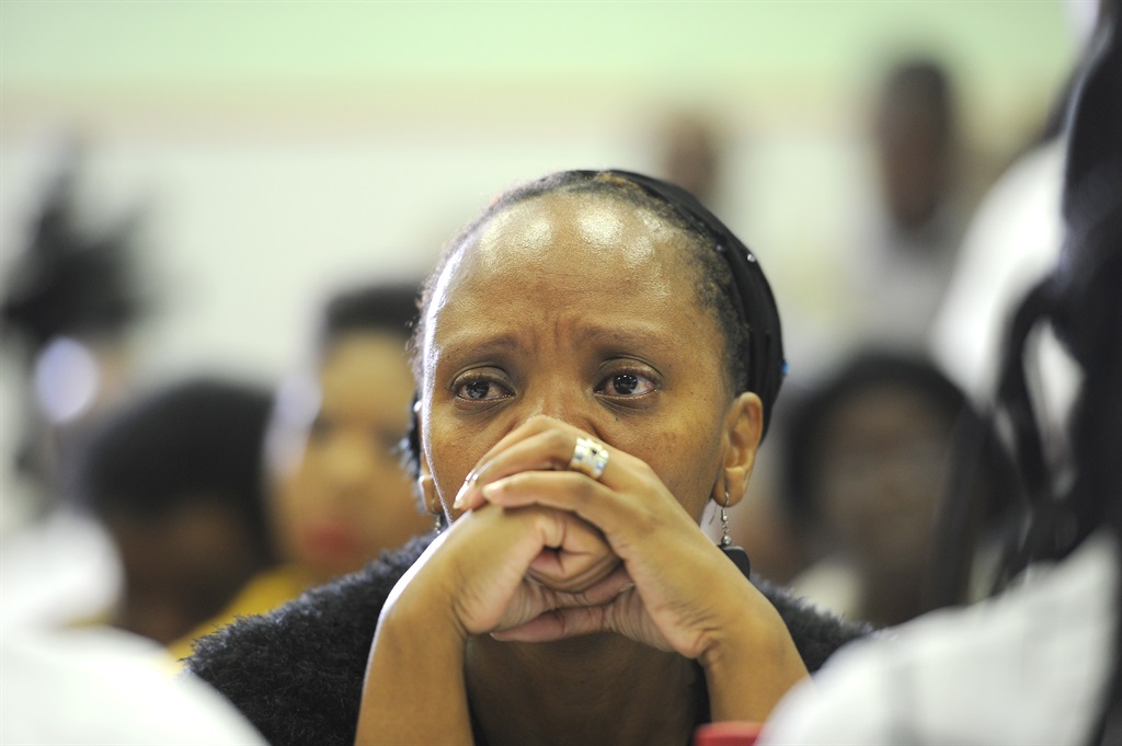  Christine Nxumalo listens as the health ombudsman tables his report on Esidimeni. Picture: Felix Dlangamandla