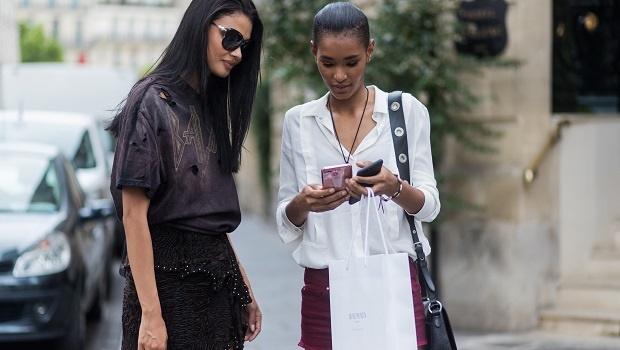 Two women looking at a cellphone