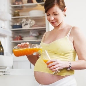 Sugary drinks during pregnancy can lead to fat kids. (iStock)