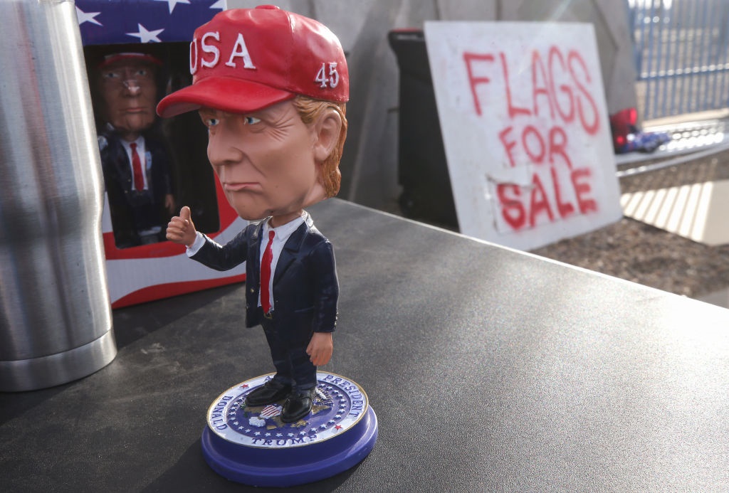 A Trump doll is for sale as supporters of President Donald Trump demonstrate nearby at a 'Stop the Steal' rally in front of the Maricopa County Elections Department office on November 7, 2020 in Phoenix, Arizona. 