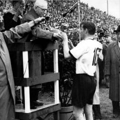 West German skipper Fritz Walter receives the Jules Rimet Trophy. (FIFA)