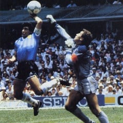Maradona scores the "Hand of God" goal to secure a win against England
