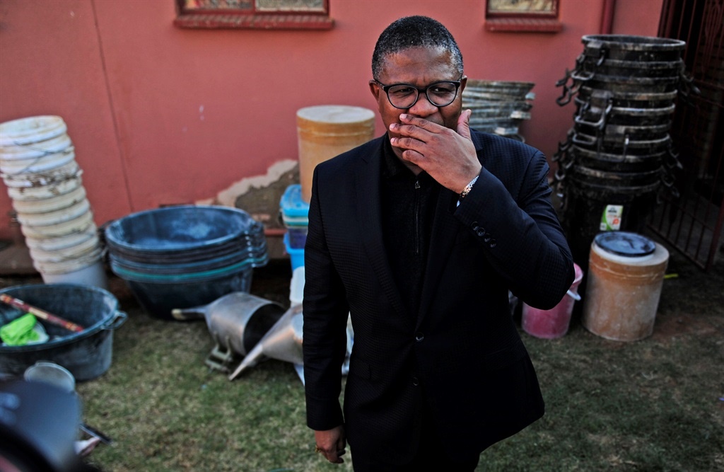 Police Minister Fikile Mbalula outside the house in Dobsonville, Soweto, where an estimated 330 kilograms of mandrax was found. Picture: Tebogo Letsie