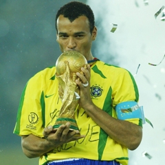 Cafu of Brazil kisses the World Cup trophy