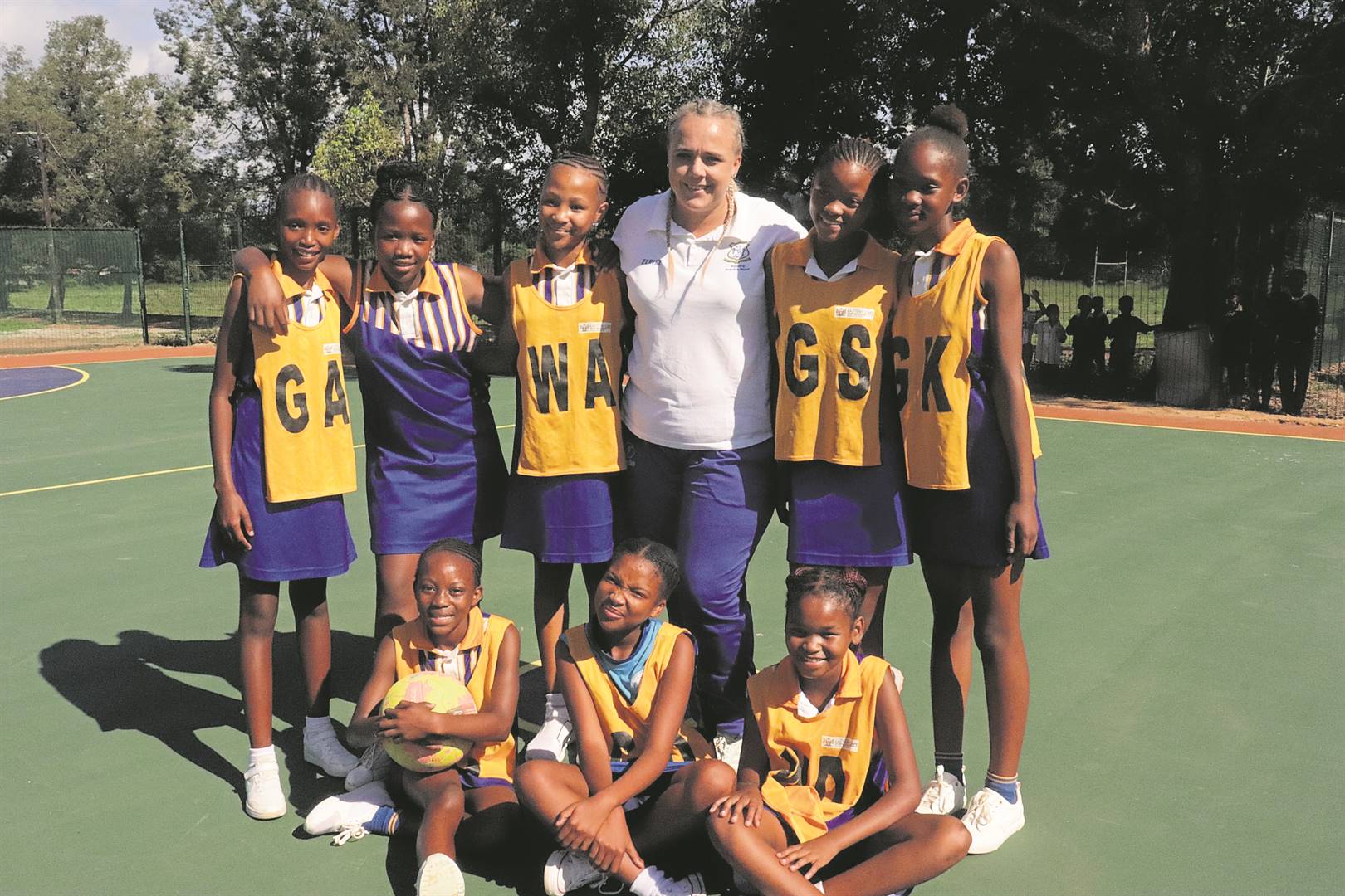 The Rietberg Primary School netball team christen their newly-built court. At the back from left areDiline Milla, Sinesipho Vusani, Kelly-Kelly Swarts, Elrike Bosman (coach), Basilina Isaacs and Ayamthanda Malgas. In front are Sinawo Mqekelana, Charlize Baartman and Lunathi Ngxizela. 