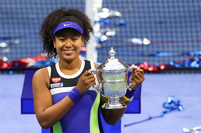 Naomi Osaka of Japan celebrates with the trophy after winning her Womens Singles final match against Victoria Azarenka of Belarus on Day Thirteen of the 2020 US Open at the USTA Billie Jean King National Tennis Center on September 12, 2020 in the Queens borough of New York City.