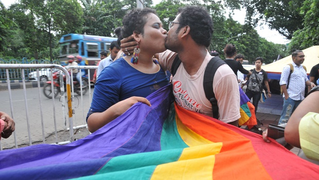 A LGBTQ couple celebrates at the India Supreme Court after the decision to strike down the colonial-era ban on gay sex