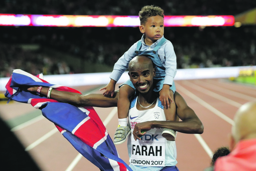 Main man: Britain’s Mo Farah celebrates with his son, Hussein Mo Farah, after winning the men's 10 000m final at the IAAF World Athletics Championships in London on Friday evening. Picture: Matt Dunham / AP Photo