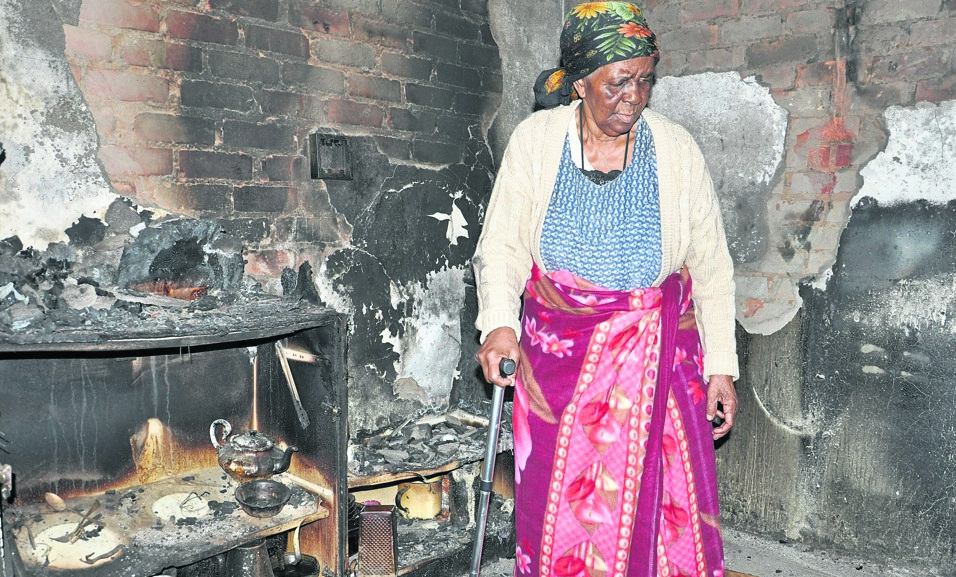 Elsie Maponya inside her house in Boekenhout after it caught fire for the second time.        Photo by Samson Ratswana