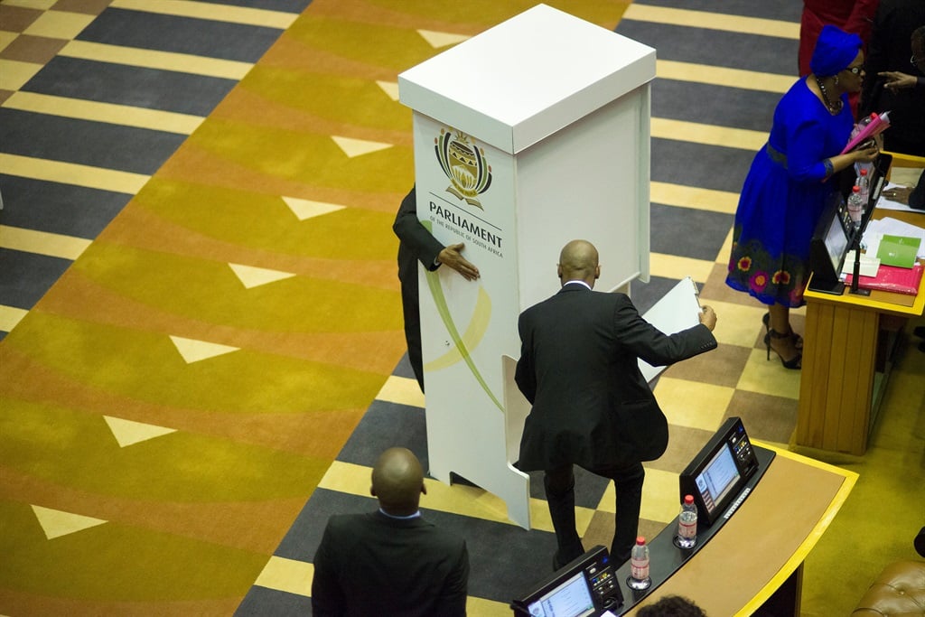 Officials prepare ballot boxes for the motion of no confidence against President Jacob Zuma. Picture: Rodger Bosch/AP