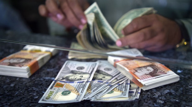 <p>The US dollar was firmer across the board on Friday, driven by the prospect of higher US interest rates as well as renewed global growth concerns, said TreasuryONE.</p><p>"Emerging market currencies have also reversed some of their gains, with the rand falling to 14.47 against the greenback in early trade."</p><p>The local unit, however, firmed 0.3% to trade at R14.40/$ by 09:37.</p>"Equity markets in the US closed in the red again and this has carried through to the Asian markets."<p></p><p><strong><em>Photo: Aamir Qureshi, AFP</em></strong></p><p></p>&nbsp; 