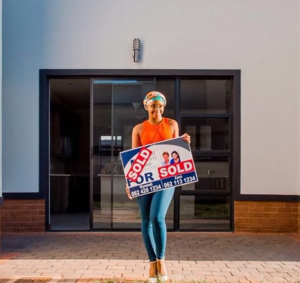 Boity poses in front of her new crib in May last year.
Photo: Twitter