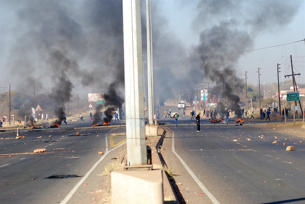 Beverly Hills residents near Ga-Rankuwa blocked the road with rocks, burning tyres and a big metal container. Photos by Samson Ratswana Photo by 