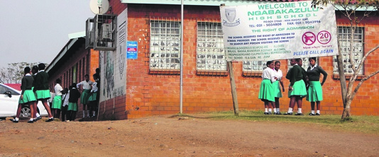 Pupils from Nqabakazulu High School wander around the premises yesterday after teachers allegedly refused to teach them. Photo by Phumlani Thabethe 