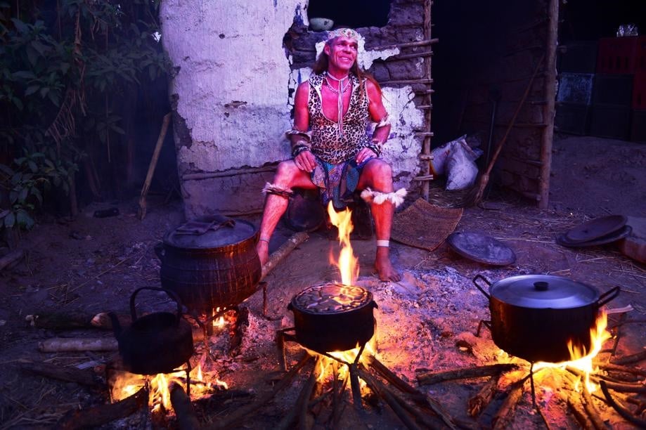 Ntombemhlophe sits around the fire at his homestead in Lusikisiki. Picture: Leon Sadiki