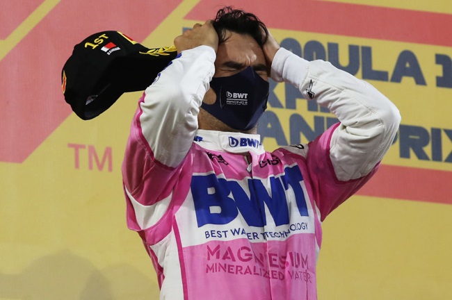 Race winner Sergio Perez of Mexico and Racing Point celebrates on the podium during the F1 Grand Prix of Sakhir at Bahrain International Circuit on December 06, 2020 in Bahrain, Bahrain. 