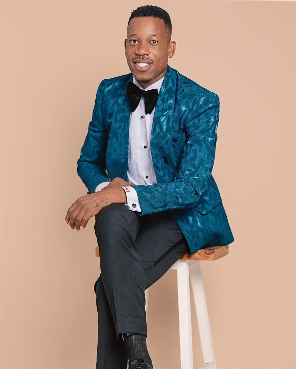 Royal AM star Happy Jele flaunts his suave formalwear outfit that is designed by high-end local brand Suit Luxe. 