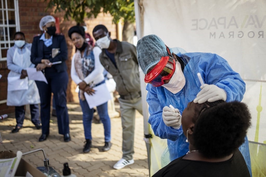 A nurse performs a swab test for Covid-19 in Johannesburg.