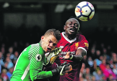 Defining moment: Manchester City’s Ederson is fouled by Liverpool’s Sadio Mané, resulting in a red card for the Reds’ man. Picture: Lee Smith / Reuters