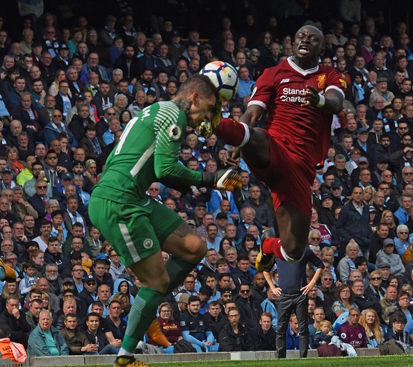 Sadio Mane of Liverpool Challenges Ederson Moraes of Man City and gets sent off during the Premier League match