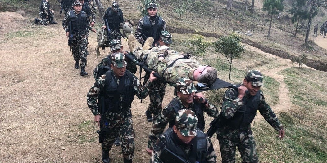 US Army Special Forces soldiers and Nepalese soldiers practice evacuating casualties in Nepal, February 18, 2020. US Army