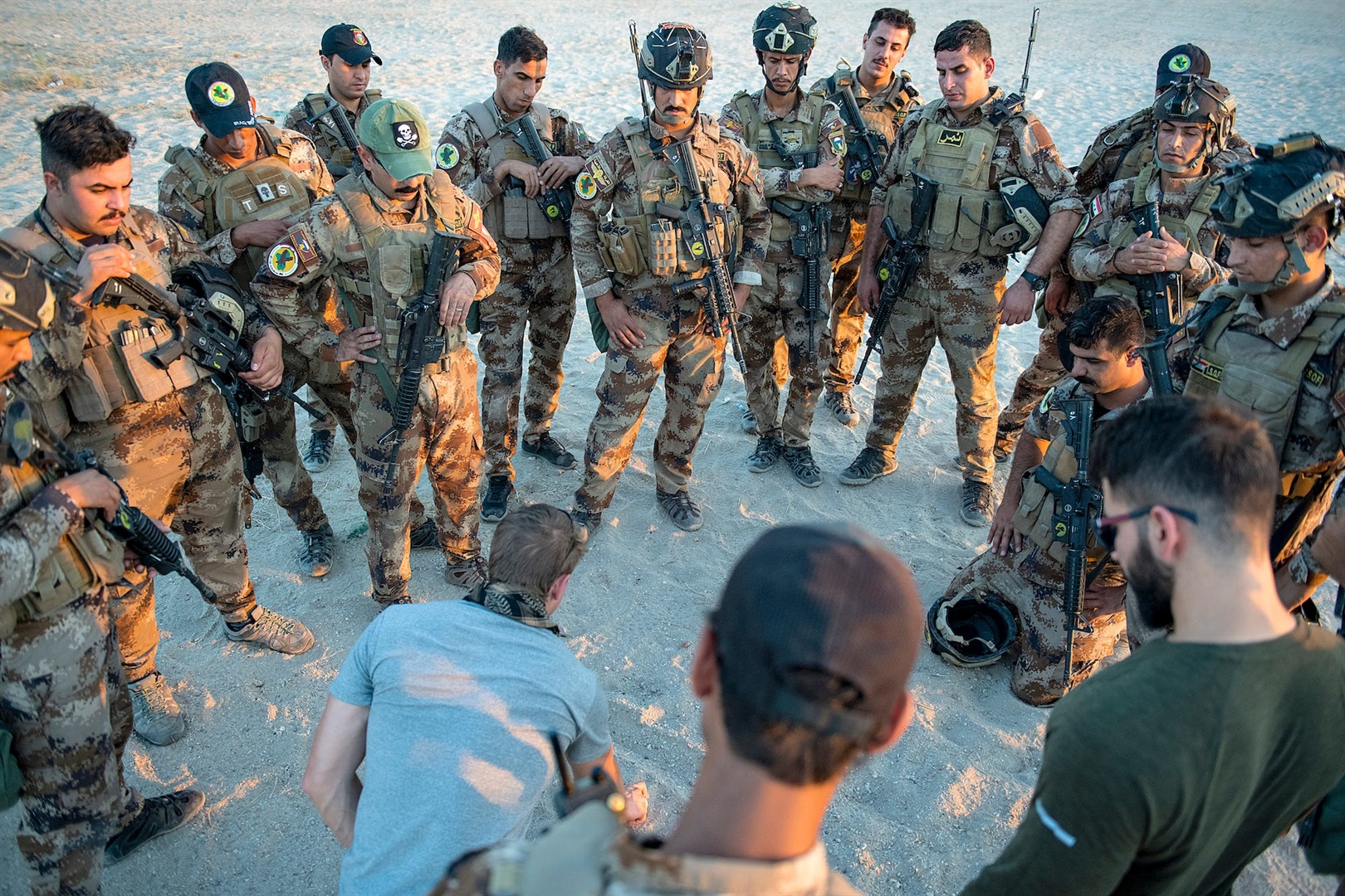 An instructor explains patrol procedures to Iraqi special-operations soldiers during foreign internal defense training in central Iraq, August 19, 2019.