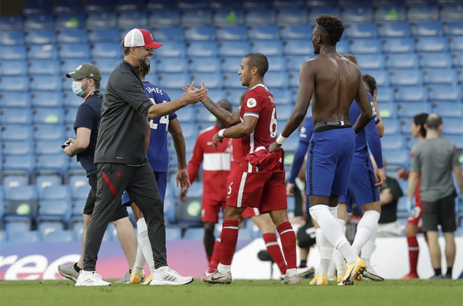 Jurgen Klopp, Manager of Liverpool and Thiago Alcantara of Liverpool celebrate following their teams victory in the Premier League match between Chelsea and Liverpool at Stamford Bridge on September 20, 2020 in London, England.