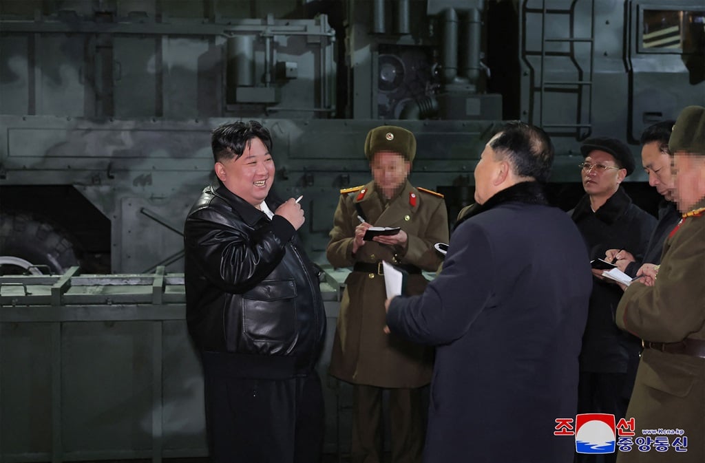 This undated picture taken by North Korea's official Korean Central News Agency (KCNA) and released on 10 January 2024 shows North Korean leader Kim Jong Un (L) inspecting a major munitions factory to learn about the production of weapons and equipment at an undisclosed location in North Korea.