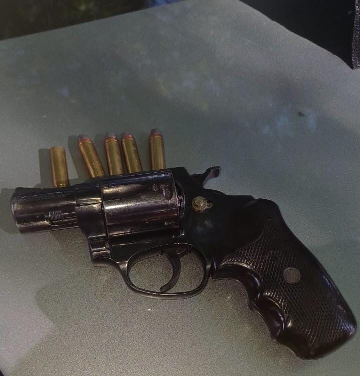 The silver-grey revolver with four live ammunition was found in the suspect's possession.