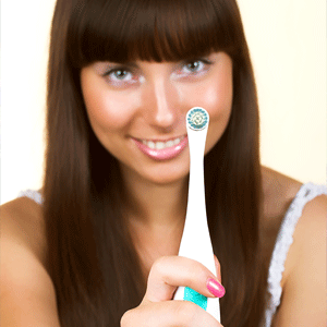 Lady with strong teeth holding a toothbrush