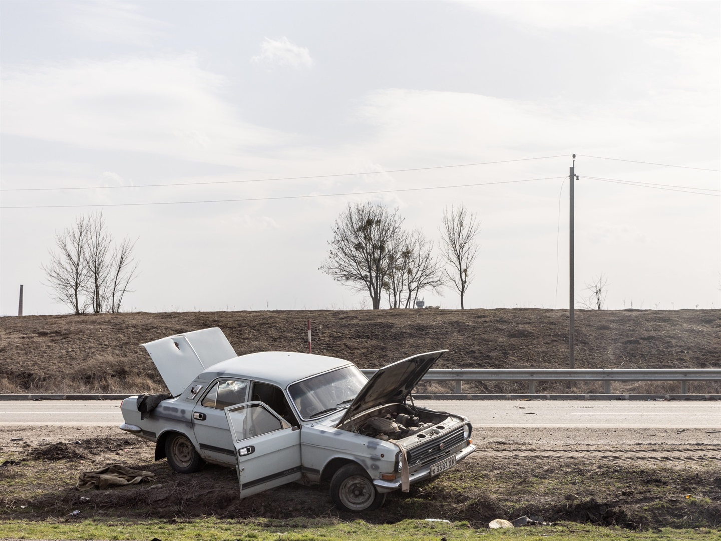 A destroyed vehicle is seen on a highway on March 31, 2022 in Malaya Rohan, Ukraine.