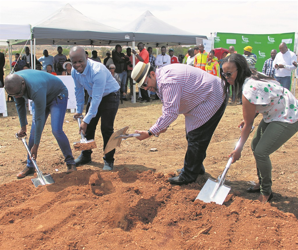 From left: Councillor Sam Mashole, MMC for Human Settlements Mandla Nkomo, Faizal Motleka, a member of Group 5 contractors, and Landela Mahlati from the City of Tshwane housing department at the sod-turning ceremony on Thursday.                  Photo by Andrew Mkhondo 