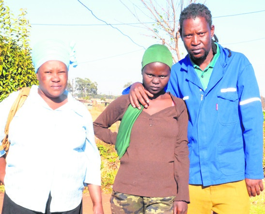 From left: Anna More, Sophy Mogapi and Sophy’s uncle Israel Mogapi are still waiting for the hospital to give Sophy her baby’s body.        Photo by Dulile Sowaga