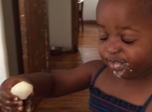 Two year old toddler tastes sushi with wasabi