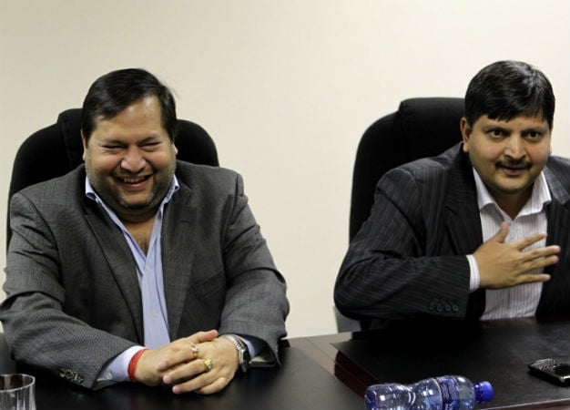 Ajay and Atul Gupta, whose sons are getting married at a luxury ski resort in June. 