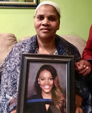 Nomthandazo Jam Jam with a photo of her daughter Aviwe. Photo: News24.
