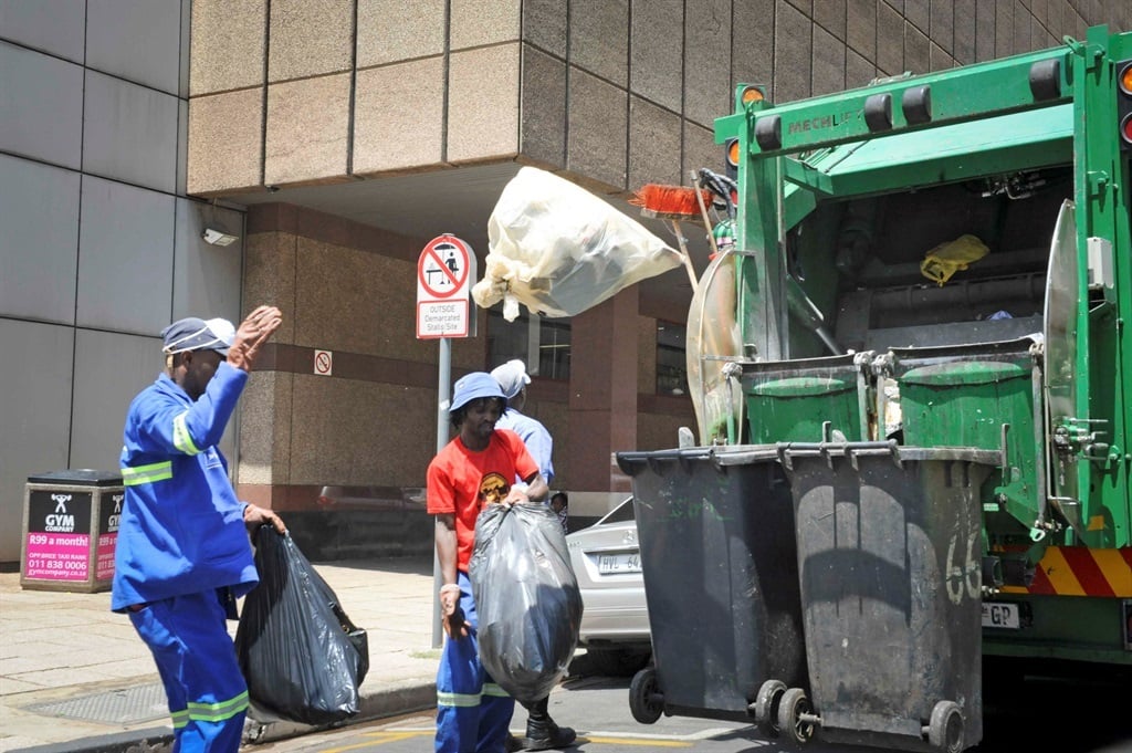 Pikitup employees remove waste in Johannesburg.