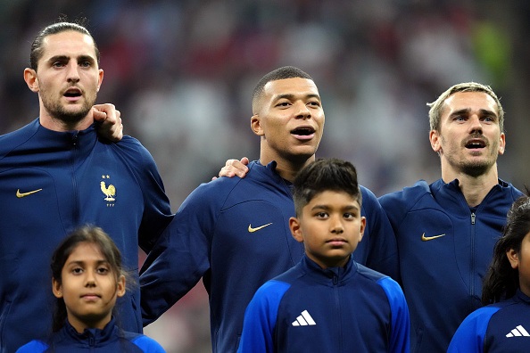 France players Adrien Rabiot, Kylian Mbappe, and Antoine Griezmann