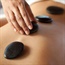 5 health benefits of a hot stone massage